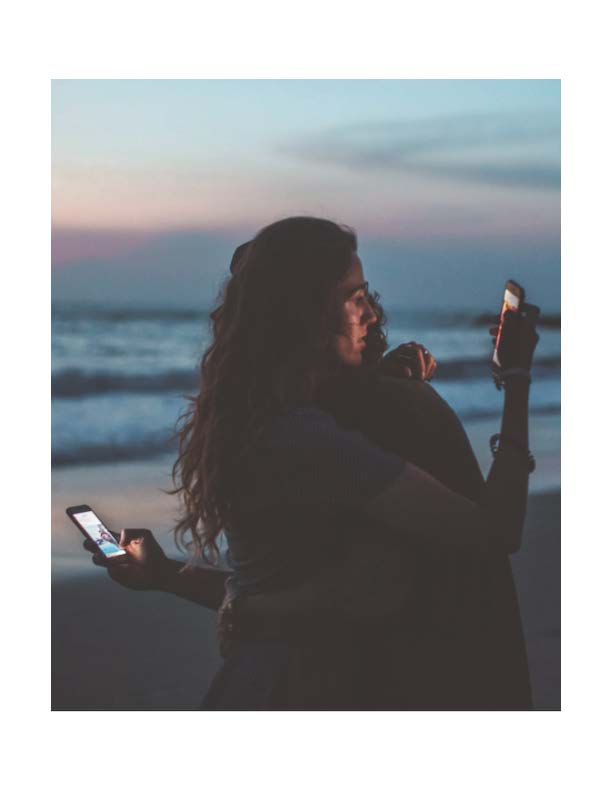 Couple distracted by phone/social media use.